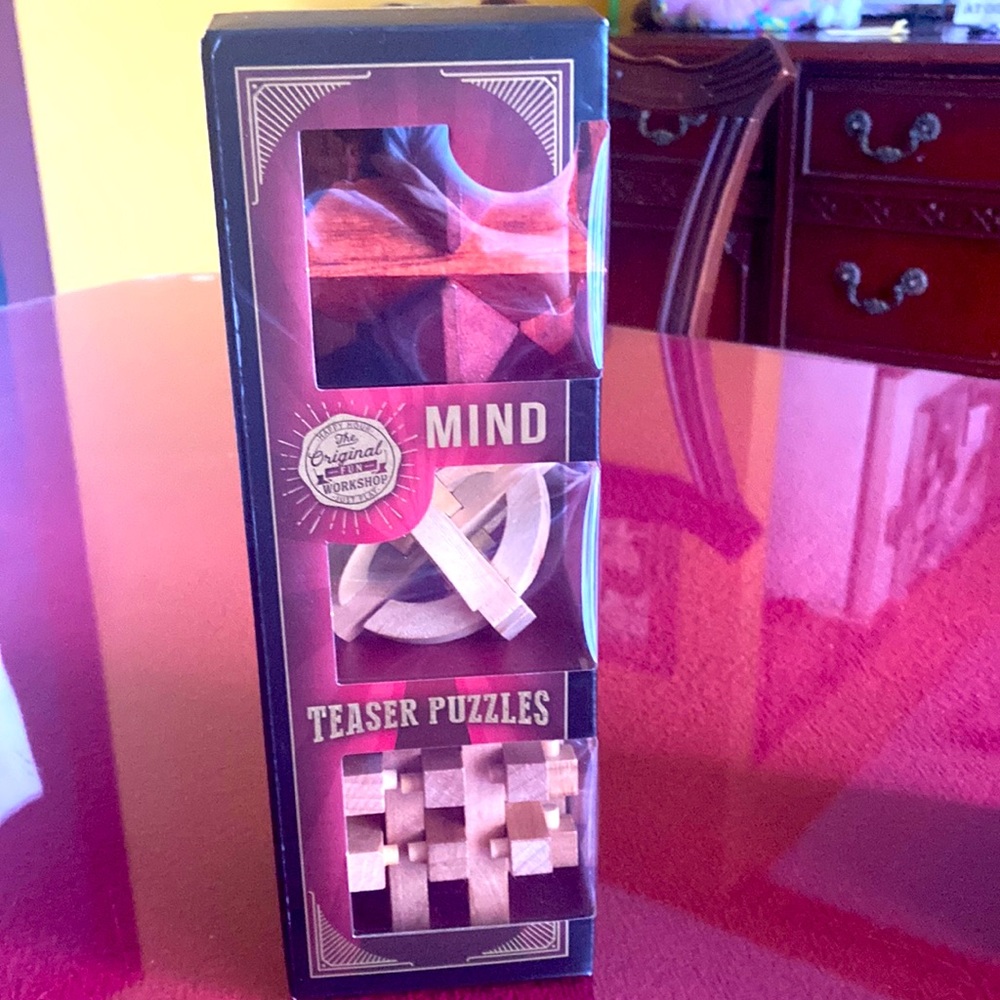NWT Teaser Puzzles. Try to get each puzzle back to original shape